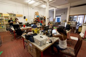 People work and collaborate on different projects in an open workspace at Makespace. Photo by Joe Thomas