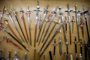 A wall of hand-made swords on the inside of Zamorano's workshop. Prices range anywhere from $100 to $4000.  Photo by Maria Amasanti